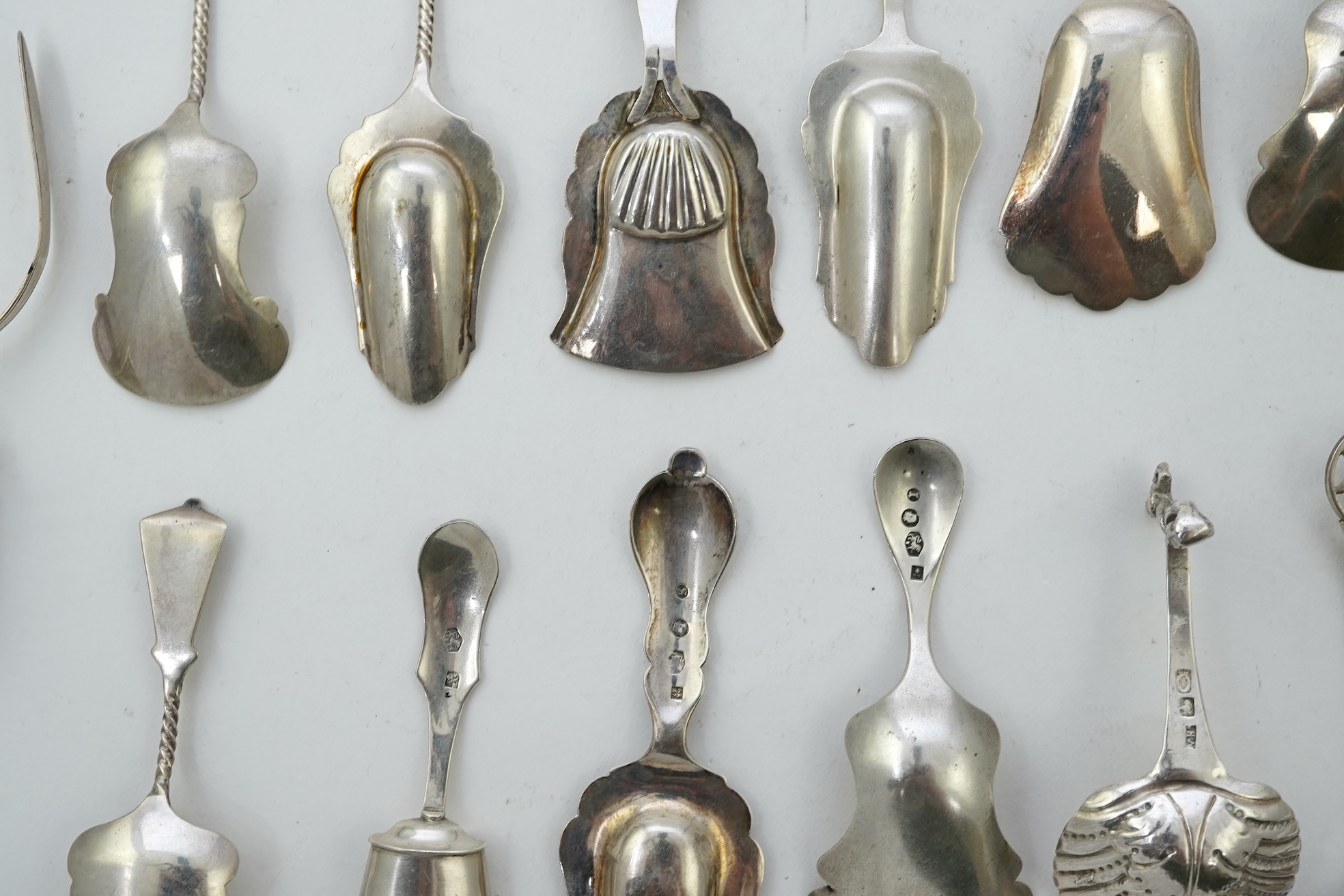 A collection of seventeen mainly 19th century Dutch white metal caddy spoons